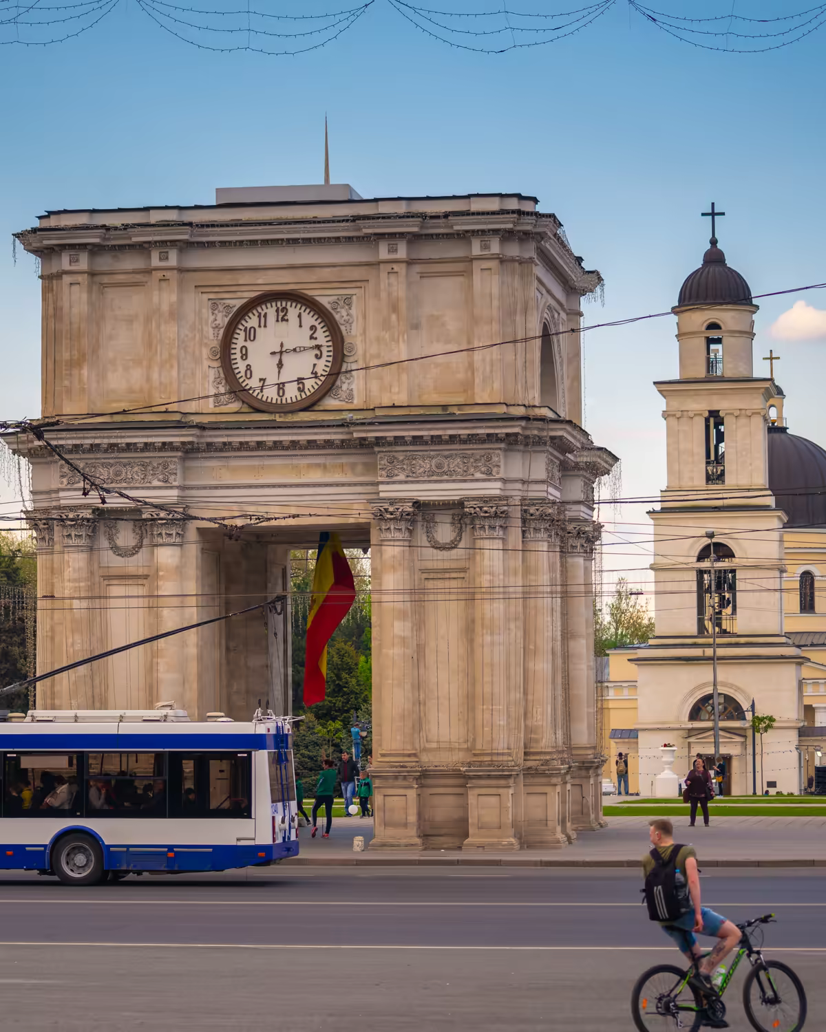 The Triumphal Arch in Chișinău's central square, the cathedral's bell tower and dome behind it.